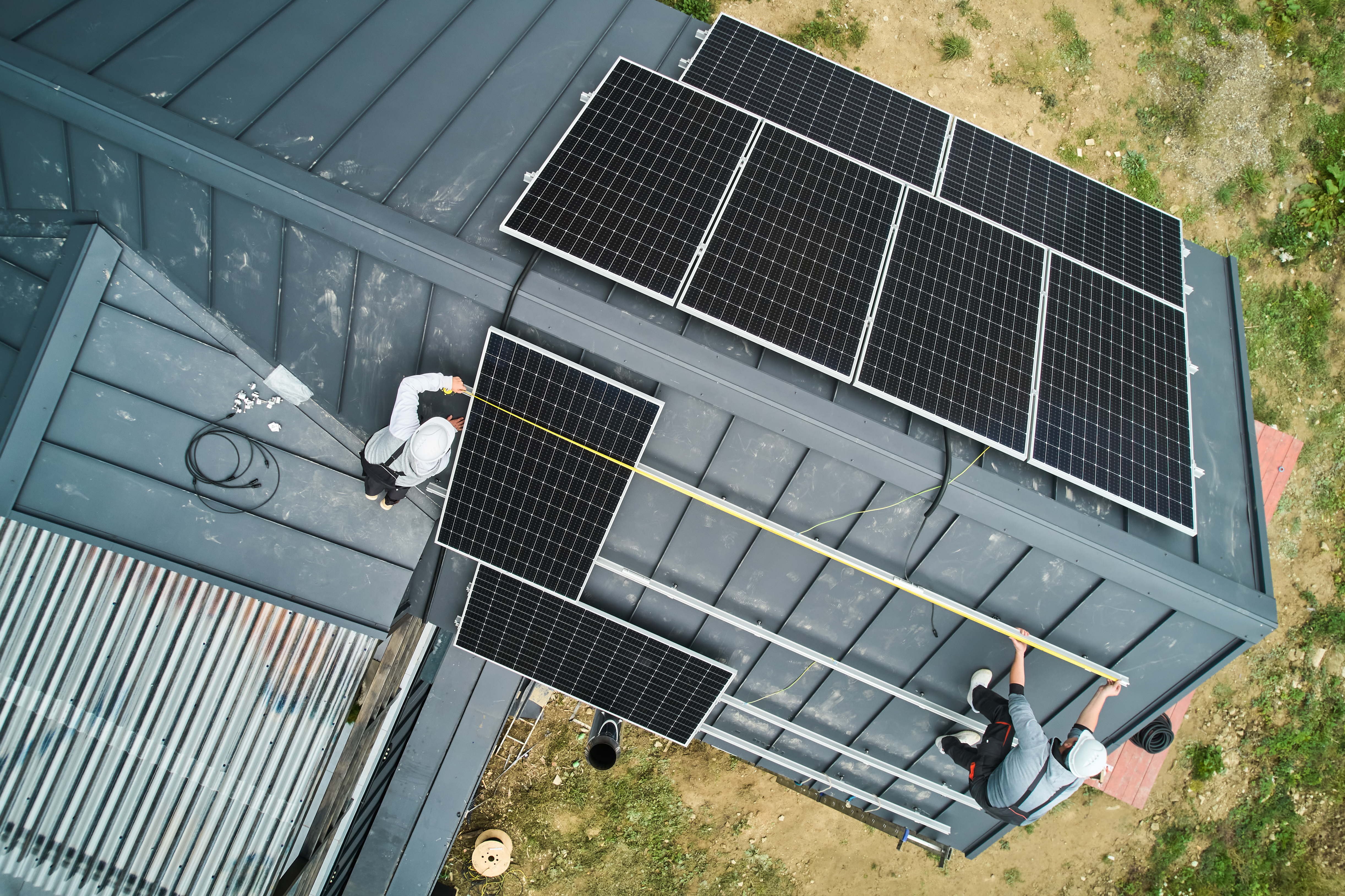 Man Worker Mounting Solar Panels On Roof Of House 2025 01 16 23 19 11 Utc